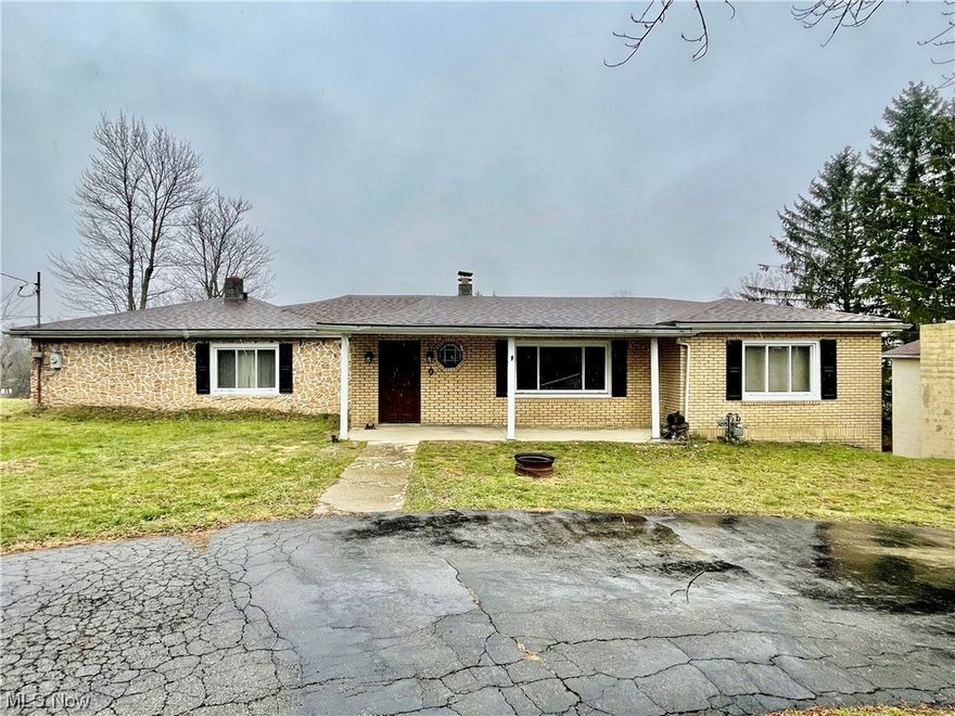 This 3 BR, 1 BA brick ranch sits on just over an acre of ground and includes a 2 story, two-car garage. The sellers were in the midst of remodeling so many upgrades have been done and it's up to you to finish! The newly added master bedroom has a huge 12x8 walk-in closet attached. The bathroom has been upgraded with new fixtures, lighting and ceramic tile flooring. All the rooms are large and the sellers enclosed the back patio to add office space. The sellers also added a “gun room” with high intensity lighting, fireproofing and multiple outlets. The oversized 2-car garage had an apartment underneath it that can be renovated. Some flooring, insulation and kitchen backsplash materials will be included at sale.