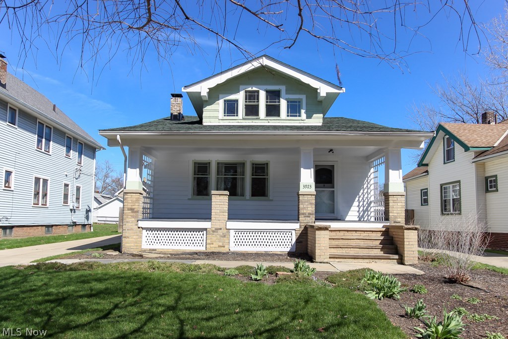 This beautifully maintained western bungalow in Cleveland's West Park neighborhood has been thoughtfully prepared for the market! This home boasts 4 bedrooms and 2 full baths! Enjoy the formal living room with built in book shelves, hardwood flooring and the arched doorway to the dining room. The spacious dining room is anchored by two beautiful corner cabinets! The original swinging door marks the entry to the cheerful eat in kitchen! The charming breakfast nook comes complete with the original bench seats and table. The current homeowners have used this space as a mud room for their kids in the winter months to put their boots, coats and backpacks. How will you use this space? Two bedrooms downstairs offer gleaming hardwood flooring and the first level bath was remodeled with the period charm of the homes construction era. Upstairs are the remaining two bedrooms and second full bath. The upstairs bedrooms are spacious and offer carpeted flooring. The lower level of this home has been
