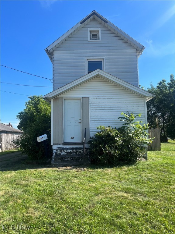 Investor special! Welcome to 18 W Faith St, Struthers – a two-story home with great bones and plenty of potential. Previously modified for accessibility, the first floor features a master bedroom and roll-in bath with shower, ideal for single-level living. The home also offers wider doorways, a ramp-accessible deck off the kitchen, and two full bathrooms. With some updates and repairs, this property could shine again – perfect for a fix and flip, rental, or primary residence with sweat equity. Don’t miss this value-add opportunity in a quiet neighborhood!