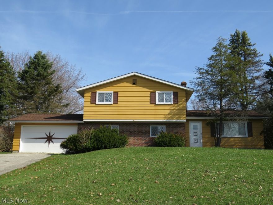 Large Split Level on a 1.60 Acre Lot! Four nice size bedrooms and 1 1/2 baths. Vaulted ceilings and wrought iron railings provide an open feel to this home. Welcoming entrance provides a coat closet and views of the main living area. Living room features a large picture window to let in plenty of natural light. Kitchen offers ample cabinet space. Family room boasts a wood burning fireplace with floor-to-ceiling brick surround and sliding glass doors that lead to a concrete patio. Expansive backyard offers a peaceful setting and is a great space to entertain or enjoy nature. Two car attached garage. Some new interior paint. Updating and your personal touches will turn this house into a wonderful home. Many possibilities! Appliances stay. America's Preferred Home Warranty included.