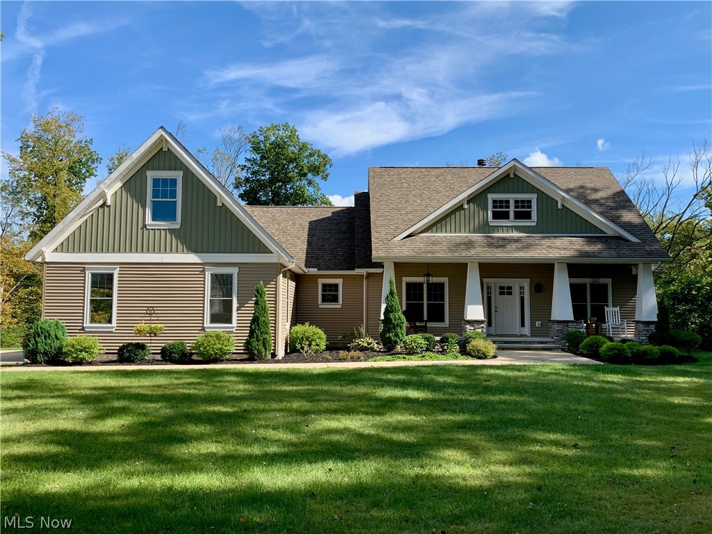 Gorgeous 5,390 SQ FT designer home, custom built in 2016 on 10.45 RIVERFRONT acres in Austinburg TWP. This stylish 4 bed, 3.5 bath Craftsman style home w/high-end finishes & flawless craftsmanship is an entertainers dream. Nestled along the Grand River, minutes away from premier vineyards in Ohio’s Wine Country, along with convenient access to Rt 90. The open yet traditional floor plan boast 9’ ceilings, a gourmet kitchen w/plentiful soapstone counter space, peninsula island, herringbone tile backsplash, farmhouse sink, a double oven and Kraftmaid cabinets, along w/solid hickory floors, fashionable fixtures, & many thoughtful designer details throughout. Enjoy entertaining in the great room w/vaulted ceilings, custom fireplace and built-ins. The front & rear porches provide ample room for relaxing. The master suite features tray ceilings, walk in closets, dual vanities, soaking tub & a marble shower. Formal dining room with chic wallpaper, stately chandelier & tray ceiling. Finished bonus room for a teen suite or luxurious guest quarters. Stunning 2,274 sq' walk-out basement w/wall to wall windows, polished concrete floors, reclaimed wood accents, guest room, on-trend fixtures, spacious living room, creative built-ins, lounge, full kitchen, full bath, large sauna; plenty of room for entertaining. Also, a heated 3 car attached garage, large utility barn and pond. A must see, don’t miss out on your dream home & call today! VIDEO: https://youtu.be/1sIK0aj5gBo