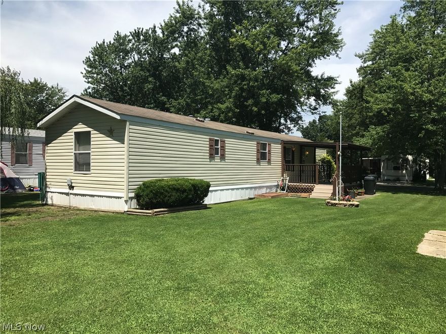 Furnished mobile on Lake Front lot. Great opportunity for someone that needs a home and furniture to set uphousekeeping!  Storage shed with electric, All appliances stay including the stackable washer/dryer. Lot rent is $235. Pets are allowed but must be on a leash. Buyer must be approved by park.  Enjoy evenings sitting on the covered deck or fishing the 4 acre lake adjacent to your back yard!