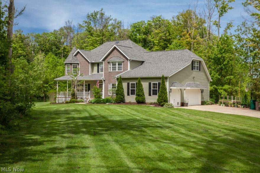Spacious Chardon colonial nestled on 2.32 acres over looking the valley. This home sits at the end of the cul de sac with a private drive. Over 3000 square feet of living area with 4 bedrooms and 2 1/2 baths and large bonus room over the garage. Master bedroom with amazing glamour bath. Hardwood floors through most bedrooms. Eat in kitchen with all appliances. Great room 26x24 with fireplace and slider to private backyard patio. Living room and dining room. Laundry room. Basement with workshop. 3 car garage. Newer items less than 5 years. Roof, siding, gutters, stone walkway and master glamour bath. This home is truly a must see!
