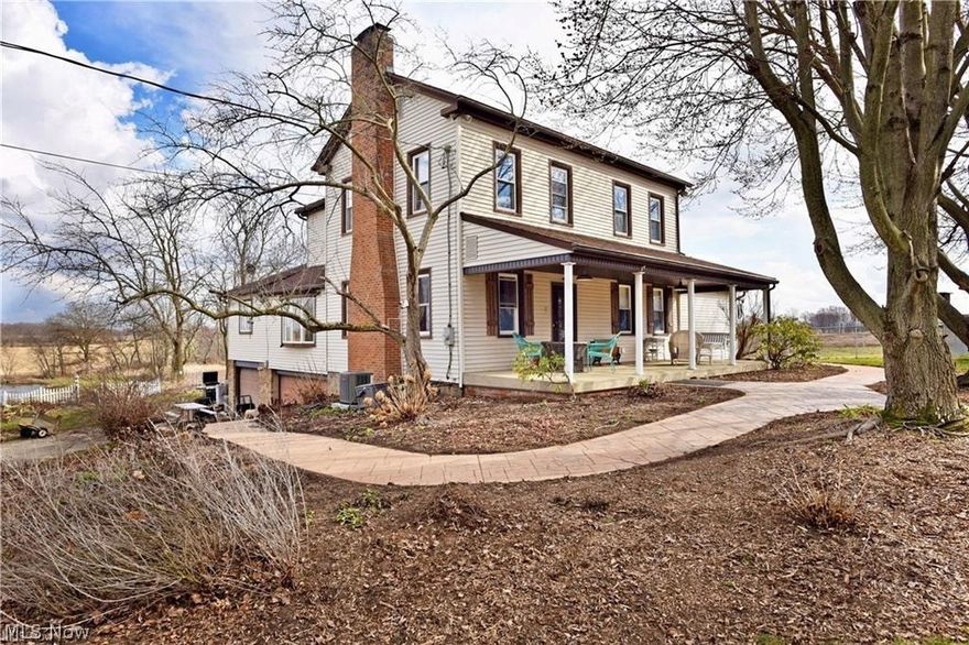 Welcome to your new lifestyle! As you turn down the tree-lined lane, you begin to sense how special this nearly 6 acre farmhouse is. Fully stocked pond for lazy days of fishing. Stamped concrete walkways lead up to a Southern style front porch. Perfect for enjoying that glass of iced tea on a hot summer day. The large screened back deck overlooks the serene fields and over an acre pond with an arched bridge leading to your own little island retreat. Within the front door the craftsmanship reveals itself as well as the modernized updates presented! Upon entering the spacious living room with stunning bookshelves, fireplace and gorgeous staircase you will be wowed by the character of the home. The sunroom with sliding doors to the deck is perfect for entertaining of family and friends. The first floor also consists of an enormous living room or billiard room with built ins. All rooms are large, including the bedrooms with extra closet space. Hardwood and lvp flooring throughout the downstairs and newer carpet upstairs. For the home chef, the kitchen is amazing in size and farmhouse style complete with quartz counters, farmhouse sink and convenient to the formal dining room. Current owners run a food blog from this kitchen. Large fenced side yard for kids and pets right outside your kitchen door. Improvements include: two furnaces and air conditioners in 2023, two pond bubblers to recirculate the water added in 2022, hookup for generator and water and electricity connections on deck area if you want to add a hot tub to enjoy the crisp Autumn air on a star filled night. All this on nearly 6 acres with a three car attached garage! Plenty of privacy, yet close to all amenities. Top-rated Lake school district. Perfect property for small farming or homesteading with the potential to be the perfect Airbnb or venue for any visionary looking to utilize this rare opportunity.(Exlcudes front room curtains)