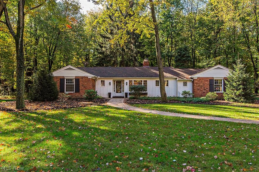 Stunning 3 bedroom 2 ½ bath ranch tucked away on 2.5 acre appealing lot on cul de sac street in Gates Mills.  Two-sided fireplace compliments the great room and kitchen.  Expansive kitchen includes heated slate flooring, dining area, counter dining, and pantry; custom wood cabinets, soap stone counter tops and upgraded stainless steel appliances.  Spectacular great room has built-in cabinet nook, wood floors and custom lighting.  Vaulted family room with walls of windows and heated floors.  Master bedroom with bath; plus, two additional bedrooms and bath.  Powder room.  Laundry area in unfinished basement.  Professionally landscaped lot.  Expansive deck with hot tub.  Two car attached garage.  Security system. Central air conditioning.  Generator.  Ambiance abounds! / Buyer to assume septic system - county has approved a drip system - estimate $34,500