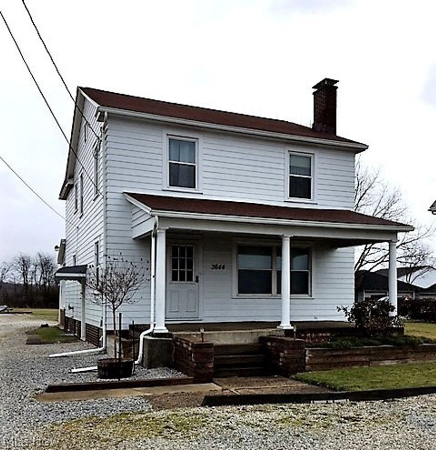 Beautifully updated home with huge backyard and 2 car Garage plus Carport.  Vinyl sided with newer roof, central air conditioning, electric, plumbing, windows, carpet & beautiful hardwood floors throughout.  So warm, charming and convenient to everything in town!