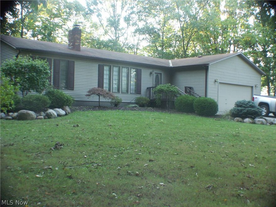 If you are looking to downsize, you must see this property!  Cozy 2 bedroom ranch situated on a secluded, wooded lot with mature oak, maple, and hickory trees.  You will find professionally landscaped yard with brick sidewalks and easy to maintain perennial gardens. House features large kitchen with adjoining eating area and family room with Vermont Castings wood burner, which greatly reduces the cost of heating the home.  Patio doors in the master bedroom and eating area open onto the  large rear deck.  With a little imagination, the half bath could be relocated and the laundry room converted to a third bedroom.  There is sunny area at the north west corner of the property perfect for cut flower beds or your vegetable garden.   There's even a 16 X 28 ourbuilding with water and electricity for a workshop or storage area.