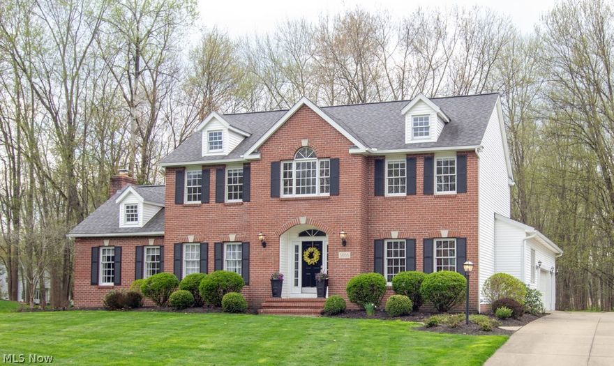 This spectacular home has been meticulously maintained and cared for.  After entering through the front door you'll find a welcoming foyer and open floor plan.  A formal living room with built-in shelves, a beautiful dining room attached to the large updated kitchen featuring granite counter tops, hardwood floors and stainless steel appliances.  The kitchen is great for entertaining.  There is also an office or 5th bedroom located on the first floor.  Additionally there is an updated 1st floor laundry and powder room with travertine tile.  The spacious family room features a large stone fireplace and opens up to an over-sized deck and park-like backyard.  The second level features 4 bedrooms.  The large master bedroom leads into the master bath that has been recently updated with double sinks and a large tile shower and soaking jetted tub.  There are 3 additional bedrooms and updated bath on this floor.  The lower level offers approximately 1200 additional square feet.  You will be imp