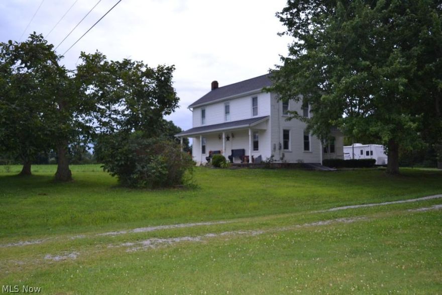 5 acres of privacy on a quiet country road located in West Branch Local School district. This charming farmhouse with newer siding and windows, boasts 3 bedrooms with hardwood flooring, an open living/dining room, and first floor laundry. Your choice of heat, either the electric furnace or the newer Brunco wood burner. With a 40x32 pole building, cinder block outbuilding and half of the lot wooded, this property is priced to sell!