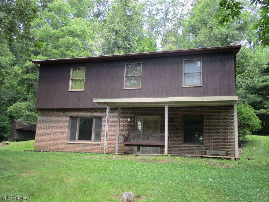 This 4 bedroom 2 full bath home sitting on just under 3 acres is conveniently located within 12 minutes from downtown Barnesville, 1 mile to St. Rt. 147 and 1.5 miles to St. Rt 800! Privacy, seclusion, peace and quiet comes with this home as its tucked away in a clearing surrounded by nature, 2 springs and beautifully matured hickory, maple and pine trees that provide plenty of shade for outdoor enjoyment. With 1684 sq. ft. of living space this home offers room for everyone with the 4 nice sized bedrooms, a kitchen and dining room off of the sizable living area, a 1st & 2nd floor bath option and a peaceful front porch where you can relax and take in the sound of the outdoors. Home offers plenty of closet space throughout and is wired for a full house generator as well, so losing power isn't a worry that can come with living out of town. You will see fresh paint throughout the home as well as brand new carpet that has just been installed 9/2020!! Lets not forget the detached 2 car garag