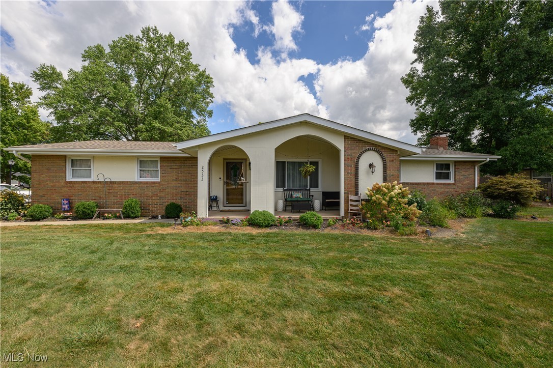 Step into this beautifully updated, move-in-ready ranch located in a prime North Dover location within Parkside. This stunning 2-bedroom, 2½-bath brick and vinyl home sits on a spacious corner lot, offering both charm and privacy. From the moment you arrive, you'll be greeted by a character-filled front porch that sets a tone of elegance and quality to come. Inside, the design is highlighted by fresh, neutral paint, updated lighting, and some newer floors throughout. The eat-in kitchen is a chef's delight, boasting an abundance of cabinetry and seamlessly flows into a spacious living room, creating an ideal layout for entertaining and everyday living. The luxurious primary bedroom is a 2023 expansion, featuring an impressive, brand-new en-suite bathroom that creates a private, spa-like retreat and an added walk-in closet with first-floor laundry. The finished lower level adds versatility and living space, making it an ideal "mother-in-law" suite. It features a huge family room and rec room, centered around a cozy stone fireplace, along with a second kitchen and full bathroom. Enjoy outdoor living at its best through the kitchen's patio doors with doggy door included to a private, fenced backyard with a patio and storage shed. With comfort and efficiency in mind, the home features a brand new AC in 2025, newer Provia windows on the first floor, a newer roof from 2018, and a newer gas furnace installed in 2020. Other recent mechanical upgrades include a newer hot water heater from 2020 and a water softener installed in 2023. A separate deduct meter for watering the lawn adds to the home's convenience. The oversized 2½-car garage provides ample room for two vehicles, a workbench, and plenty of additional storage. This lovingly maintained home is packed with high-quality updates and so much more—a perfect blend of style, comfort, and functionality awaits!