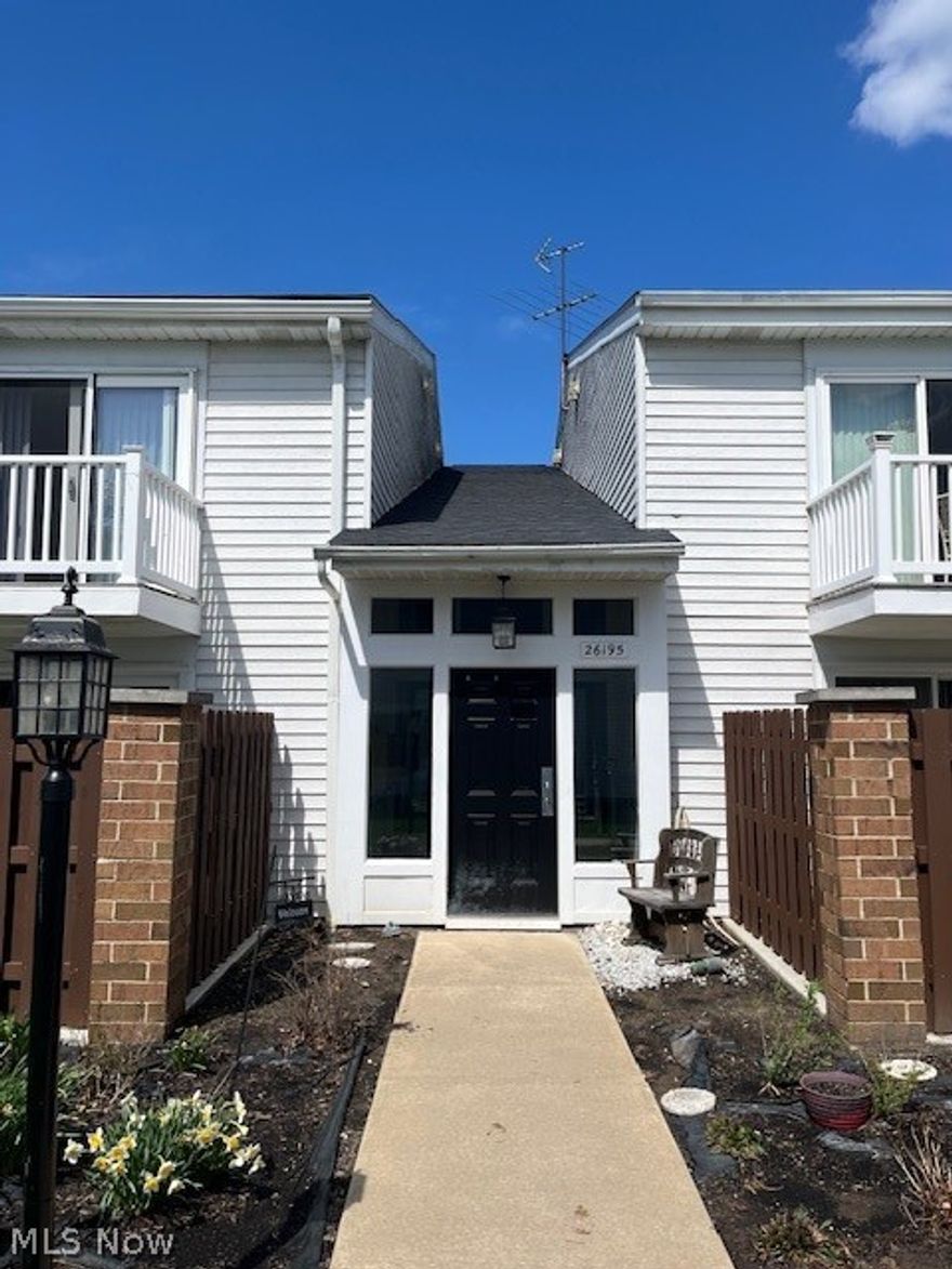 Prepare to be moved! Welcome to this charming condo in desirable Olmsted Falls. Enjoy peaceful living in a tranquil, park-like community surrounded by mature trees and rolling green hills. This 2-bedroom, 2-bathroom condo offers 1,125 square feet of comfortable living space and is ideal for first-time homebuyers or anyone seeking convenient single-level living. Step inside to a bright and airy main living area filled with natural light. Large sliding glass doors lead to your private enclosed patio, perfect for morning coffee or relaxing evenings outdoors. The pass-through breakfast bar connects the living area to the kitchen, creating an open layout ideal for entertaining. The kitchen features sleek stainless steel appliances, including a flat-top range and built-in microwave, complemented by rich espresso cabinetry offering ample storage. Enjoy the convenience of in-unit laundry tucked neatly behind classic bi-fold doors for a clean, streamlined look. Both bedrooms and bathrooms are located on the main level. The spacious primary bedroom offers generous closet space, while the second bedroom is perfect for guests, family, or a home office. Additional highlights include your own private detached garage. Just a short walk, enjoy the community pool surrounded by lush landscaping and mature trees. The beautifully maintained common grounds feature expansive green space, shade trees, and a charming picnic area, perfect for outdoor gatherings. A serene pond with a central fountain creates a picturesque setting for peaceful walks. Recent updates included Lighting, interior paint, and bedroom carpet (2026). Conveniently located near highways, shopping, and dining, and about 20–25 minutes from Downtown Cleveland. Located just minutes away from park that offer scenic trails, covered bridges, and waterfalls along the Rocky River.  Don't miss your chance to make this condo your own! Cats alowed but no dogs