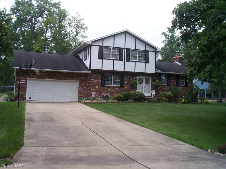 Great move-in ready 3 bedroom home on large level lot. Freshly painted & tastefully decorated interior. Totally remodeled baths and a new roof! Large updated kitchen with granite countertops, spacious family room. Large screened porch and open deck. Ideal for family entertaining!  Extra storage above garage.  LB#31669704.