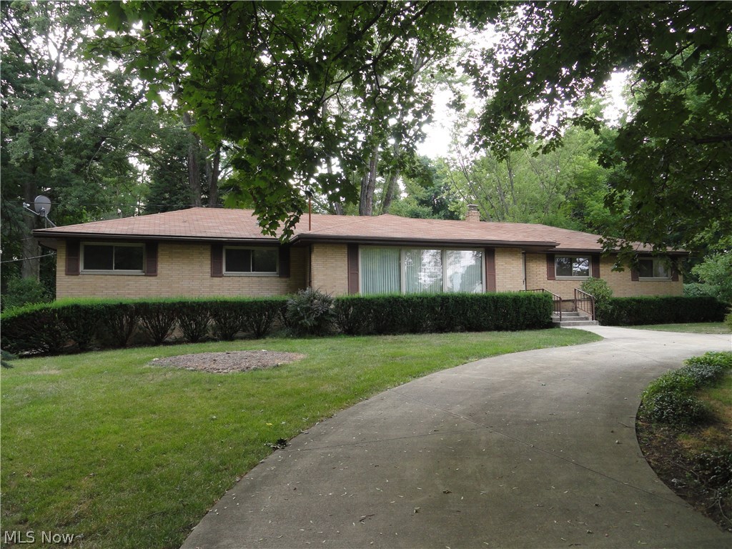 Solid brick ranch has impressive curb appeal with circular driveway and mature landscaping. Very appealing floor plan that is open and spacious. Huge formal living room with gas fire place and formal dining that opens to the well equipped kitchen complete with newer appliances and breakfast bar. Sliders to generous sized heated sun room. 3 bedroom and 2 full baths on the 1st floor. Wonderful finished areas in the lower level which includes two rec room areas, a second gas fireplace and large storage room area. Two car attached garage with nature stone floors and 1st floor laundry. Quick access to hike & bike trail or playground, ball field, tennis courts and the river.