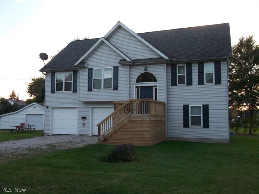 Spacious move-in ready 3-4 bedroom home built in 2003!  Large yard with 170 frontage, 2 car attached and 1 car detached garage with extra storage.   The home features open living room with vaulted ceiling to gorgeous eat-in kitchen.  Lovely master suite, lower level office or 4th bedroom, and  newly finished family room with walk out to backyard.  What a wonderful home to call yours!