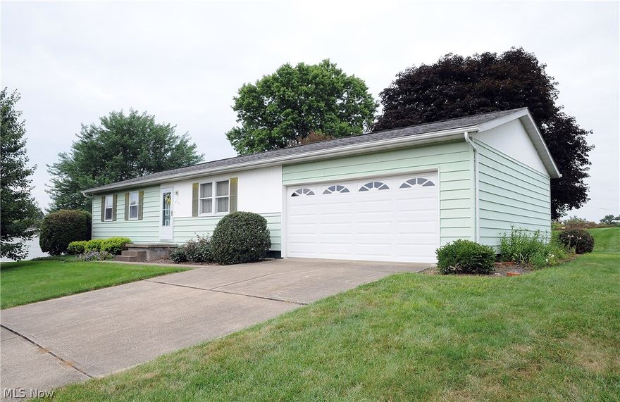 Darling 3 bedroom ranch on nice level lot with maintenance free deck,  fully appliance kitchen, finished basement - 2 car garage, shed in yard, public water.