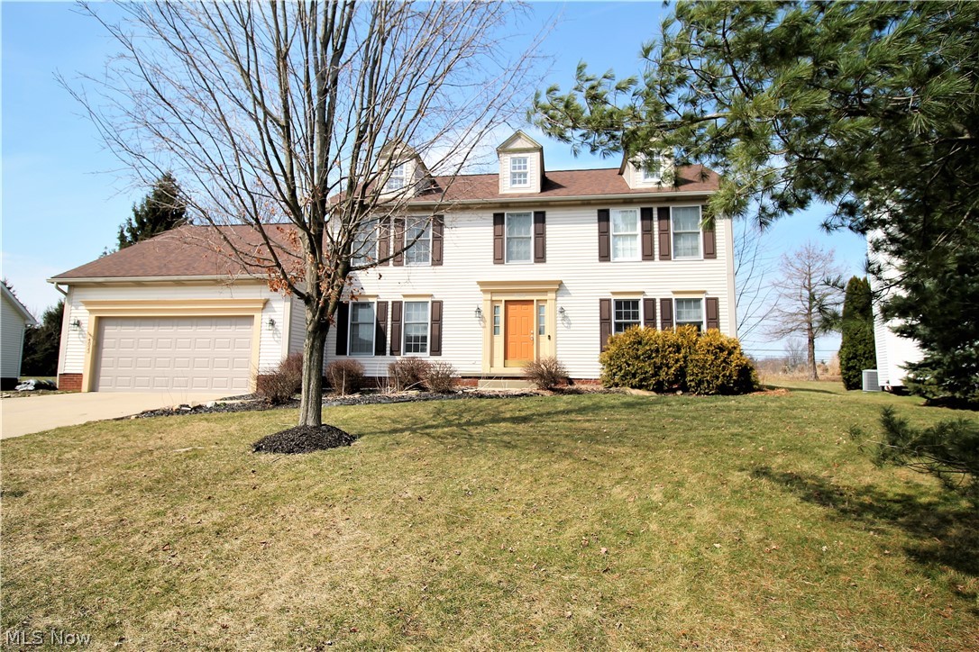 Welcome home to this beautiful four bedroom, two and half bath colonial. First floor offers a very spacious and open floor plan with oak flooring in the living room, dining room and entrance way. The fabulous kitchen opens to a eat in area with built in desk and sliders to the gorgeous large deck that overlooks the backyard. Kitchen has new sink 2015 and updated ceramic tile with plenty of cabinets and counter space. The kitchen is all open to the family room that boasts a gas fireplace and has wall of windows that over looks the backyard. The first floor laundry and half bath finishes the first floor. Upstairs there are four bedrooms one of which is the master suite with walk-in closet and spacious master bath with garden tub, shower which has a new shower door that was replaced in 2019 and dual sink vanity. There are three spacious bedrooms with closet space and a full bathroom. All bathroom fixtures were replaced in 2016. The finished lower level offers a bonus room for enter
