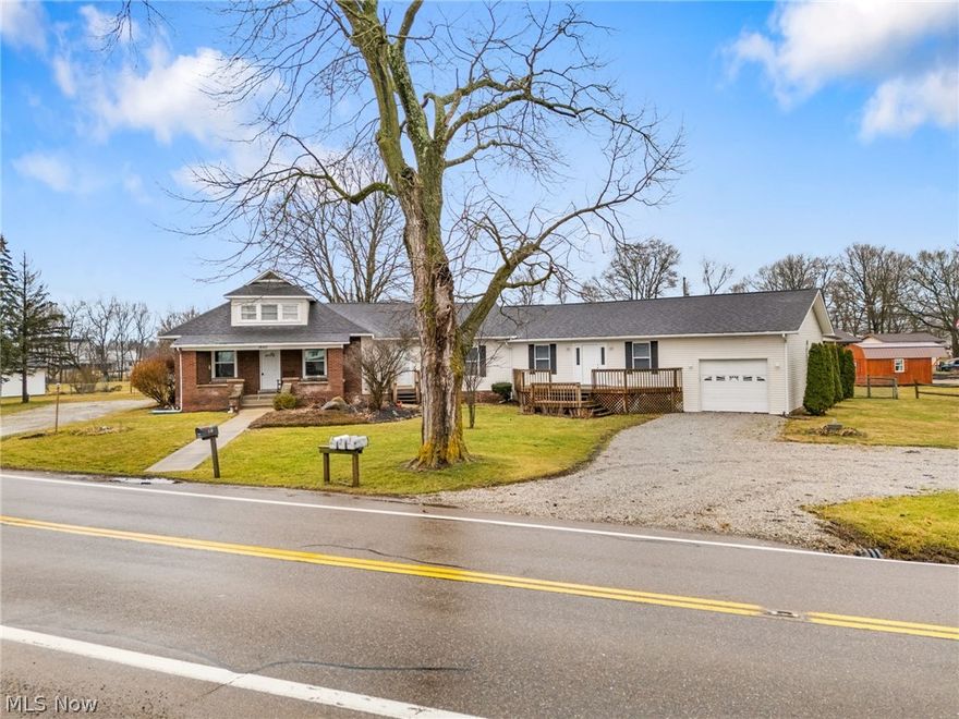 Welcome to this one-of-a-kind property combining space, character, and a peaceful country feel just minutes from town. Set on over 1.5 acres, this 3 bedroom, 3 full bath, and 1 half bath home blends the charm of the original house with updated living spaces, including a newer kitchen and additional living areas that offer a flexible, functional layout. With two kitchens, multiple living rooms, and first floor laundry, there’s plenty of room to spread out, making it perfect for multigenerational living or a large family. The main bedroom features sliding glass doors that open to a back deck overlooking the yard and pole barn, a serene spot to relax or entertain. Outside, you’ll find two driveways, a one-car garage, and a pole barn with water and electric, ideal for storage, hobbies, or equipment. Schedule your showing today!