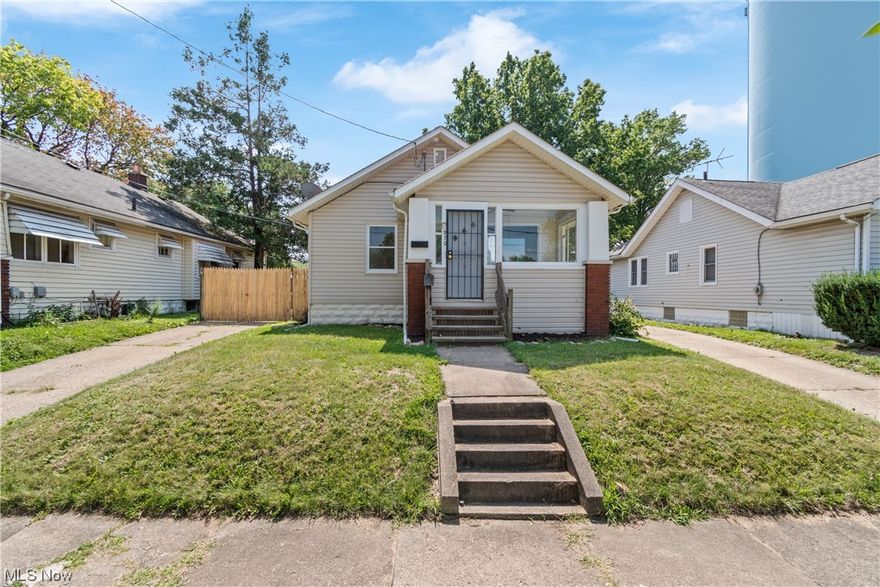 Check out this cute ranch! Welcome to 970 N. Firestone Blvd, a solid ranch style home featuring 2 (possible 3 bedrooms) and 1.5 baths -- 2 bedrooms on main floor, plus a bonus room in lower level previously used as a 3rd bedroom. Large open living room with large picture window & window seat. Finished front porch. Eat-in dining room attached to kitchen with built-in shelving and spice shelf. Great fenced-in backyard with driveway privacy fence and 1 car garage with opener. Lower level utility room is huge and great for storage. Lower level bonus room or 3rd bedroom w/ closet w/ half bath. Since owning seller has made numerous updates including; new electric, new plumbing, brand new LVP floors, furnace, new garage door and new exterior doors. Move-in ready. Call today and make this one yours!