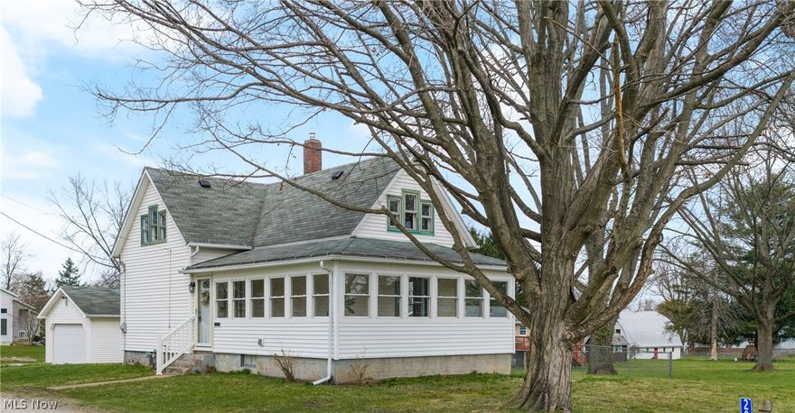 This home showcases a captivating blend of old world charm with tasteful attention to detail and extensive updating transitioning it into a beautiful residence. The 3 season sunroom greets your guests while the wrap around area with it's expansive windows provides the perfect spot to relax and enjoy nature's beauty from indoors.  Upon entering the home's dining room you'll quickly notice that  the freshly painted neutral walls, woodwork, and LVT flooring of the first floor creates a seamless flow from room to room.  The welcoming living and dining areas offer generous space, ideal for everyday living and entertaining.  This unique blend of comfortable livability, thoughtful design and updates continues into the kitchen.  Here, a wall of windows above the counters and sink fills the space with natural light, creating a bright and cheery place.  Featuring a pantry, brand new refigerator (installed after pictures), dishwasher, cooktop and built in oven, you have everything you need for preparing family meals.  A versatile bonus room on the first floor, accessible from both the interior and the back porch, offers endless possibilities—perfect for a first-floor bedroom, office, or laundry room, with water access available. The remodeled first-floor full bath includes a walk-in shower.  Upstairs, sought-after character continues with the primary bedroom featuring a walk-in closet, along with two additional bedrooms, creating quiet and inviting retreats from your day.  The freshly painted walk-out lower level provides additional potential space and storage.  Outside, enjoy the detached two-car garage with a covered side porch overlooking the yard and above-ground pool, all set on a generous .78-acre lot. Water hookup available at the street adds future potential.  Come and experience first hand this quiet country setting.  It's convenient location, charming character and thoughtful updates put this beauty in a class of it's own.
