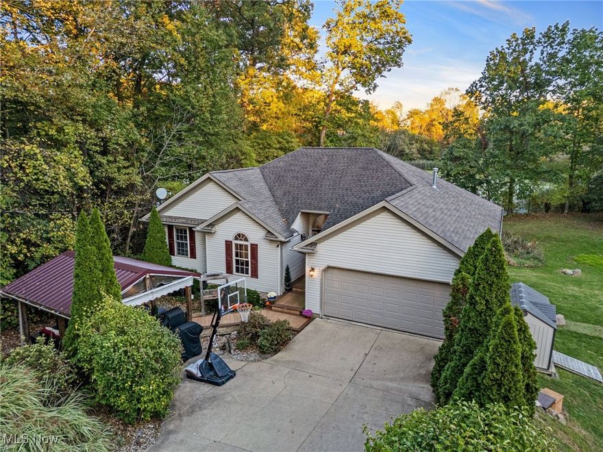 Are you looking for a home that has been completely updated?  Look no further than this beautiful Ranch home with a finished walkout lower level.  Location is everything...This home is just minutes from the highway and Portage Lakes. The home is located on a cul-de-sac with a view of a pond out back.  As you walk in the front entrance you will feel right at home with the spacious great room featuring a gas fireplace.  Enjoy a quick meal in the dinette or a more intimate dinner with family and friends in the dining room.  The updated kitchen offers plenty of space to prepare meals, a pantry and quartz countertops.  The laundry room is just off of the kitchen and leads to the two-car garage.  You will love the owner's suite featuring a large shower, long vanity w/sink and walk-in closet.  To finish off the main floor there are two more bedrooms and a full bath.  The area that you will spend most of your time entertaining or relaxing with friends and family are located in the walk-out lower level that is fully finished featuring a huge family room, dinette area, L-shaped wet bar, game/tv room.  There is also a fourth bedroom with an egress window, lots of closet space and a half bath. The utility room offers additional storage.  If you want to enjoy the outdoors there is a covered deck in the front that is cozy and private. Updates since 2020: Paint, Flooring, Light Fixtures throughout the home, Remodeled Kitchen, Appliances, Owner's Suite Bathroom, Quartz Countertops in Kitchen and Baths, Basement Fully Finished, C/A 2023.  There's nothing to do but move in and enjoy entertaining!  Call today to schedule your private showing!