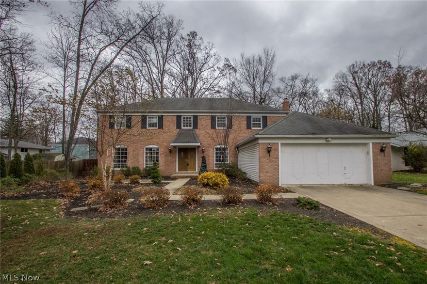 Stately 4 Bedroom brick front Colonial w/ stunning curb appeal has you desiring to peek inside. Once in, you a greeted with an open and airy two- story foyer that leads to the bright and cheery kitchen employing newer appliances, warm wood cabinets, granite counters, center island, large pantry,planning desk, and beautiful laminate hardwood floors. Partial freshly painted interior. Family room w/  tile surround fireplace, formal living and dining rooms, First floor laundry room, large Den/Office and bath round out this level  Upstairs the Master retreat awaits featuring an en-suite full bathroom and large walk in closet; three additional generous sized bedrooms and a full bath finish this second story. Downstairs a beautifully finished basement allows for family get-togethers and  game night. This L-shaped space provides plenty of room for both a media/family center and also pool table or game center. Picturesque backyard  offers a stamp concrete patio and is the ideal spot for enterta