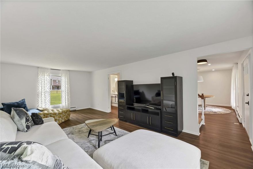 Discover timeless charm in this home, featuring beautifully refinished original hardwood floors throughout the second floor. The first floor boasts new luxury vinyl plank (LVP) flooring, combining modern durability with style for a seamless, elegant look throughout the living spaces. Step into the stunning kitchen featuring elegant quartz countertops, custom cabinets, and brand-new stainless steel appliances. Unique touches, such as a touch faucet, beverage center fridge, and kitchen appliance lift, make this kitchen both beautiful and functional, perfect for culinary adventures and entertaining alike. Indulge in the luxury of the master suite, featuring a brand new bathroom with modern fixtures and finishes. The spacious walk-in closet offers ample storage, creating a serene and organized retreat for relaxation and comfort. Unwind in the cozy ambiance of the bonus room, complete with a charming gas fireplace. Perfect for relaxation or entertaining, this versatile space adds warmth and character to your home. Experience the refreshed elegance of this property, boasting bathrooms with brand new vanities featuring ample storage and sleek, modern toilets. The contemporary design and updated fixtures create clean, inviting spaces for daily routines. Don't miss out on this amazing home, schedule your showing today!