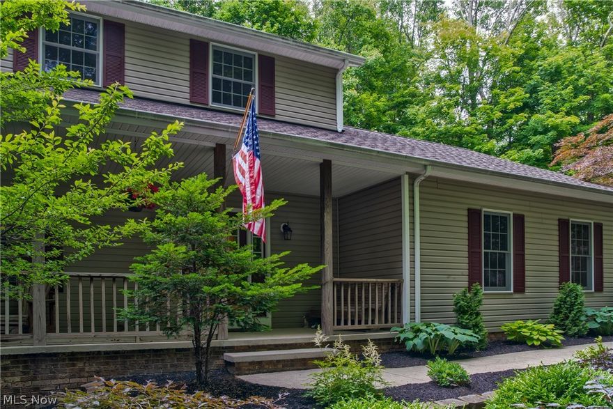 Beautiful ravined lot with trees surrounding this home, sitting on a little over 3 acres.  When driving into this property you will first notice the large 6-car plus outbuilding that its 56 x 28, the front has a concrete floor, is heated, insulated, and has water, attached is a 24 x 24 cold storage garage with a gravel drive and its own garage door. This building is amazing and has so many uses. Wether you are storing collectable cars, or need a building for your business, you will love this man-cave.  The home is pre-wired for a security system, has newly installed granite counters in the kitchen and half bath. The great room has as a gas fireplace with a stone hearth. Three bedrooms up, plus a fourth bedroom on first floor currently being used as an office. The open stairway leads to the walk-out basement, finished with a complete bar with water and a half bath, this room walks out to a cement patio and is a perfect place for an above ground pool. The steps lead up to a two tiered de