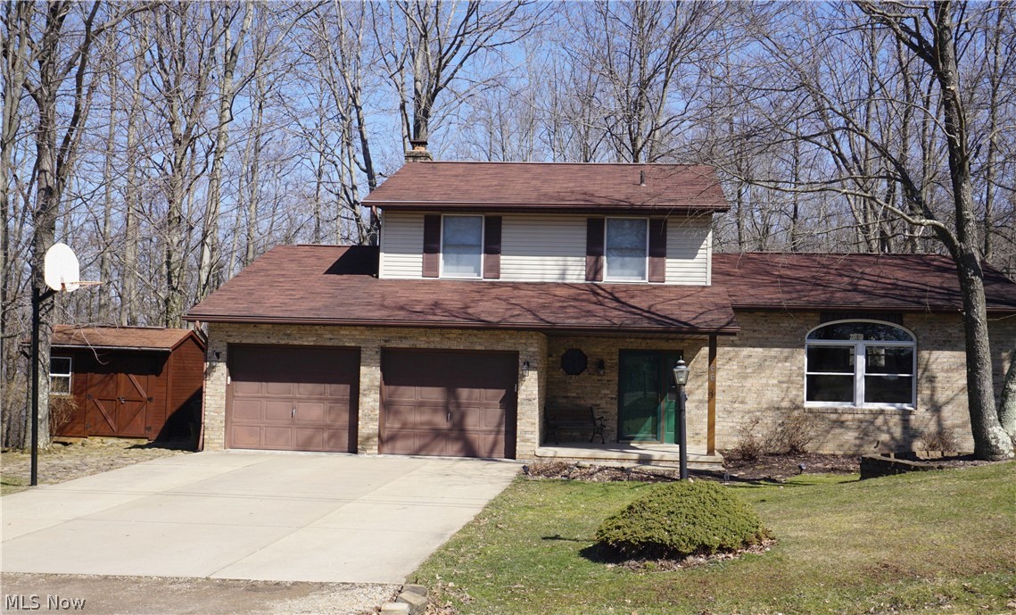 Rare find at Lake Mohawk.....Four bedroom home with two lots, shed and level driveway. Very nicely maintained, open floor plan with vaulted ceiling and neutral décor in living room. Three bathrooms have been updated. Spacious kitchen with ceramic tile flooring, and full array of appliances. Foyer entry leads to beautiful family room with wood burning fireplace. Multi level deck from family room is great for family gatherings and entertaining. Lowest level has finished room that would make great "man cave" or hobby room and also has a walkout to back yard. Included with this package is landscaping with barn stone and large firepit in back yard along with wood playset. It's time to make Lake Mohawk your place to call home.