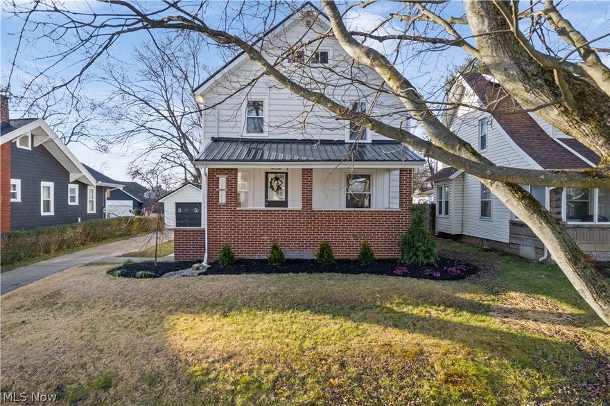 Beautifully renovated colonial home on quiet street in the perfect neighborhood! Enter from the covered front porch to the foyer which has a new 1/2 bath addition. In the kitchen, everything is completely new with concrete countertops, luxury vinyl flooring, and Fridgidaire appliances. Large kitchen window overlooks back yard. Dining room and living room are open to each other, with refinished hardwood floors. Upstairs are 3 bedrooms with charming glass doorknobs and hardwood floors in two bedrooms, carpet in the 3rd. The bathroom is all new, it has a jacuzzi shower tub, new vanity, lighting, toilet and ceramic tile. 3rd floor walk up attic is beautiful too, it is excellent for storage but could become a man cave, craft area, playroom, etc. Basement is clean and freshly painted with large glass block windows. More 2022 updates: Metal roof on house and garage, all windows except the large middle kitchen window, hot water tank. Outside, fresh landscaping and nice large lot with room for