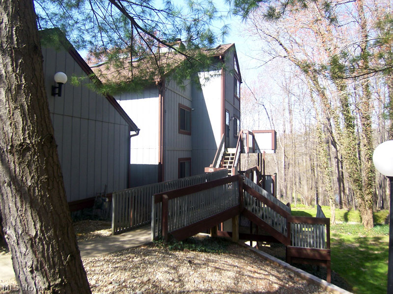 Best Value in Pine Mill ridge. This dramatic unit overlooks the Cuyahoga Valley and is both scenic and private. This homeowner has done plenty to update this condo. The 1st floor has beautiful wood laminate flooring. There is a stone fireplace. Kitchen includes all appliances and has new upgraded laminate countertops including breakfast bar. The entire interior has been repainted between 2013 and 2015. There are 2 bathrooms and garage with storage. This association fee covers heat, water and sewer. all you pay for is Electric. There are 2 pools and much much more!