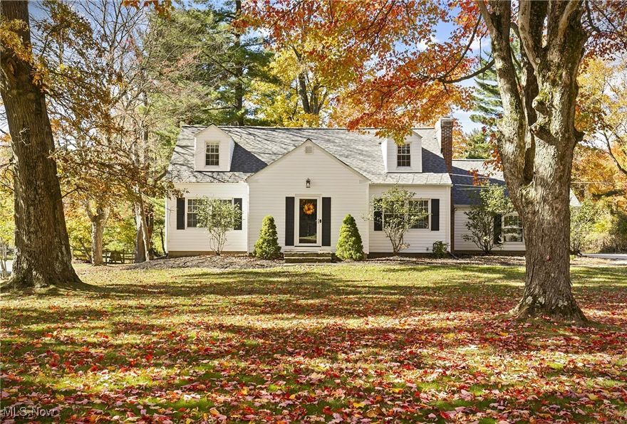 Time to FALL in love with a new home!*   Tucked away at the end of a cul-de-sac, this picture perfect Cape Cod style home sits on a large 1.4 acre lot, offering a quiet country location yet is minutes to premiere shopping spots and dining at Eton and Pinecrest, as well as minutes to popular Chagrin Falls village.   Many new features and practical updates were completed in the last few years, all for the new owners to enjoy.   As soon as you pull up to the home, you’ll notice the new concrete driveway (2022) and new patio + back stairs (2022) overlooking the pretty backyard.   Siding and all the windows were replaced within the last ten years, and a new tear off 30-year roof installed in 2021.  Inside, the home is light and bright and features an open floorplan, with lots of views of the peaceful and private yard.  The living room is anchored by a wood burning fireplace, and the dining room features views of the backyard and access to the patio.  The kitchen has newer cabinetry, granite countertops, and a new gas stove.  The entire first floor features original hardwood floors, adding character and charm to this attractive home.  There are 2 bedrooms on the first floor and a full bath.   The second floor features an open design, with 1-2 bedrooms and another full bath, with new flooring, walls, and a closet.   The walk out lower-level rec room is filled with sunlight from south facing windows and also features a utility room / laundry room with a newer Kinetico water system and hot water tank.  Chagrin Falls mailing address, highly regarded Orange School district, low Orange Village property taxes.   Your new home for every season.  Shown by appointment only.  **MULTIPLE OFFERS HIGHEST & BEST OFFER TO BE SUBMITTED BY 10am Monday October 20, 2025**