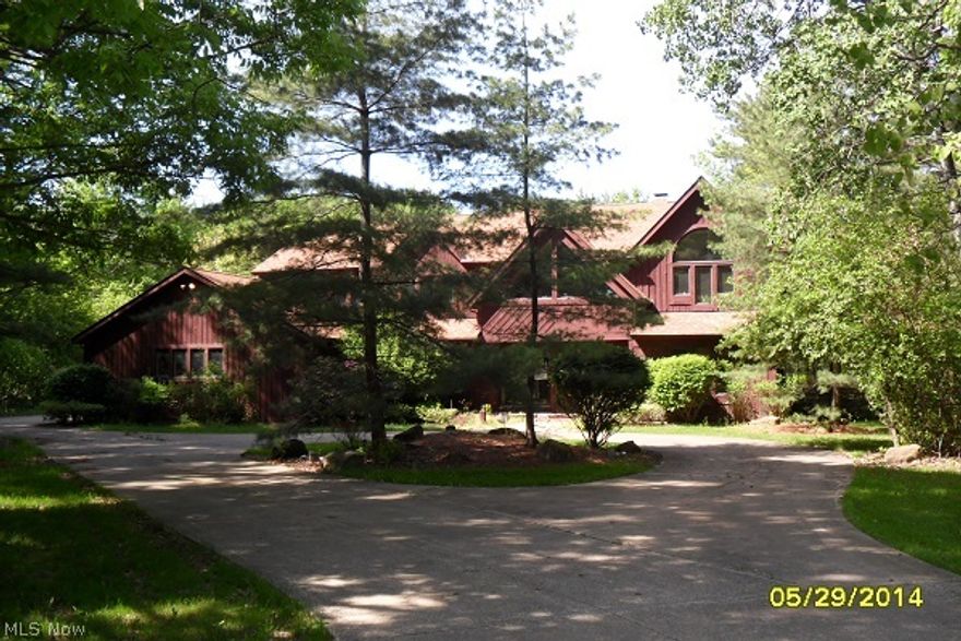 BANK OWNED FORECLOSURE!  Large home great for entertaining features a large private wooded lot with almost 2 acres of land.  This property features contemporary open floor plan with vaulted ceilings.  Features gourmet style kitchen with granite center island, ceramic tile, sub zero refrigerator, double ovens.  Nice hardwood floors in living room, dining room and den.  Large family room with vaulted ceiling that overlooks private backyard.  Huge master suite with fireplace, sitting room, walk-in closet and large glamour bath.  This property also feature a large finished walk-up basement.