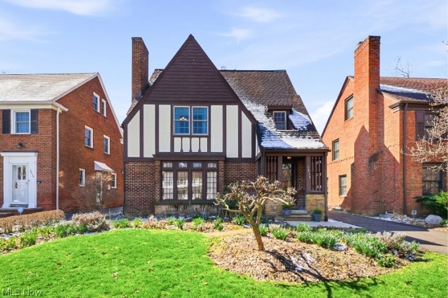 Quintessential Heights Tudor full of charm, character, and true pride of ownership! Lovingly maintained by the same owner since 2007, this home offers peace of mind with major updates including a new roof (2013), windows(2008/2025), exterior paint (2021), and freshly resurfaced driveway (2025). A seller-provided home warranty adds even more confidence for the next owner. Step inside and feel the warmth immediately. The spacious living room with a wood-burning fireplace flows seamlessly into the dining room and inviting sunroom—creating an ideal layout for both everyday living and entertaining. The kitchen offers abundant storage, complete with a breakfast nook and pantry. The second floor features three bedrooms and a large full bath, beautifully preserved in its original charm. The third floor provides a flexible fourth bedroom or bonus space, while the finished basement offers additional room to spread out. Over 2,100 finished SQ FT. Outside, enjoy mature perennial gardens with hydrangeas, peonies, irises, lavender, and more. The yard offers the perfect balance of sun and shade, with a private deck and bright sunroom to enjoy throughout the seasons. Ideally located just blocks from the Heights Library and Walter Stinson Community Park (“The Walt”), known for its beloved community events, playground, and green space. Convenient to shopping, dining, and everyday amenities—with a new Trader Joe’s coming to University Heights this fall. Easy access to University Circle, downtown Cleveland, major hospitals, and the region’s renowned cultural institutions. Move right in and enjoy as the gardens begin to bloom this spring!
