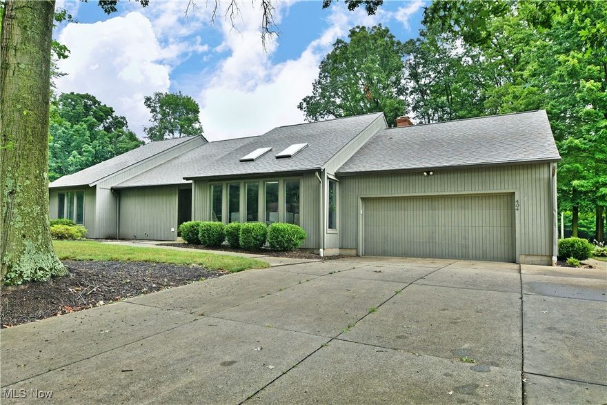Treat yourself to the opulent surroundings of this meticulously crafted Cortland home! Two floors of masterfully updated living space await to include a fully finished basement with two bar areas, a full lower bath, game room and lower family room for easy entertaining. The stunning residence peers from beneath the tree lined frontage as natural colorways create plenty of curb appeal. The matching garage door creates a sleek, incorporated design element as tall windows allude to the inner living space. Around the back, the impressive, tiered patio space includes custom stonework and an inset grill area for backyard barbeques. Meanwhile, a hot tub resides along a privacy fence with instant master bedroom access. Inside, the open central floor plan enjoys tall, sweeping ceilings with multiple skylights that adorn both the living room and formal dining space. A tiled foyer spills into the decadent kitchen with its massive, stone-topped center island with inset wine cooler. Decorative lighting pairs with custom drawer pulls as the tiled backsplash runs behind a hooded range. Additional fineware dining storage presides below a serving counter. Down the main hall, a gorgeous full bath delights with its marbled shower. Three impressively sized bedrooms with additional first floor laundry provisions. The master suite wows with a walk-in closet and its own full private bath.