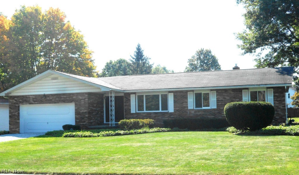 Inviting all BRICK three bedroom, one & a half bath, ranch. Family room offers sliders to patio and woodburning fireplace that could easily be converted to gas (existing gas line has been capped). Kitchen has been updated with newer lighting, fixtures, flooring, refaced cabinets & newer hardware. Full bath has newer tub surround. The half bath has been totally updated and the home offers newer carpet as well as a freshly painted interior. Central air was replaced in 2012. This home has been well maintained. Over sized two car garage is an added bonus.