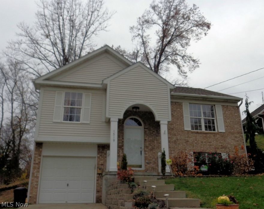 Amazing 3 bedroom 2 bath home with open concept floor plan.  Beautiful kitchen with tile back splash opening to rear deck.  Large great room.  Finished lower level.  Attached garage.  New carpeting, flooring, paint and fixtures.  Move-in ready.  Just beautiful!