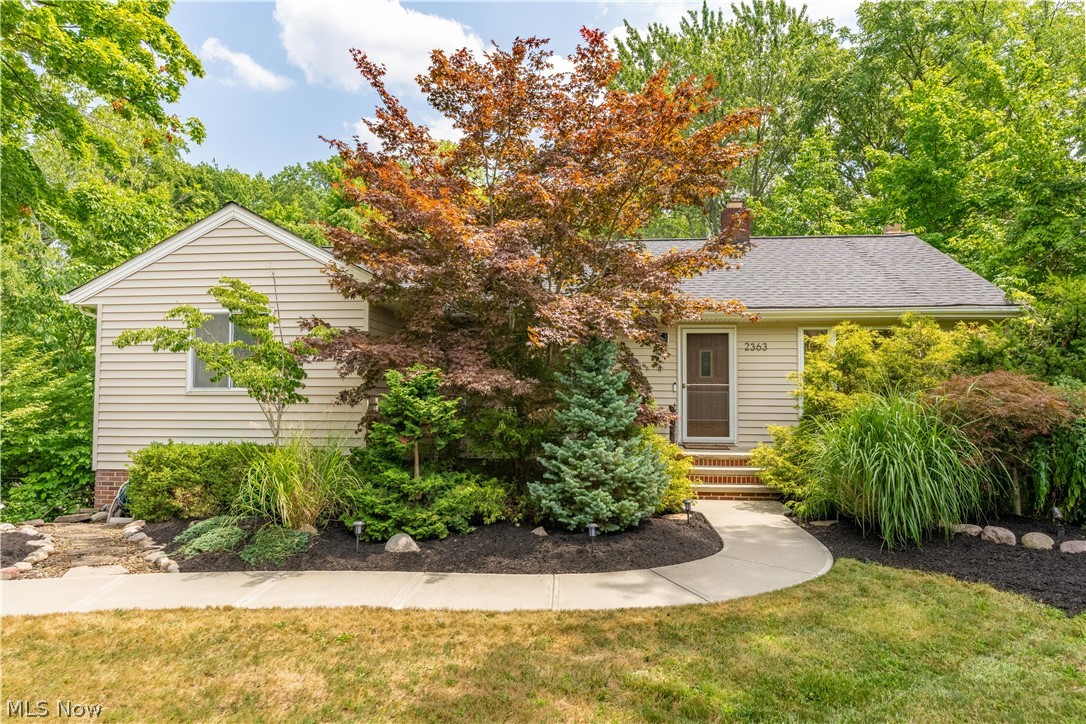 Stunningly rare opportunity to own a ranch with a heated, in-ground pool and walk-out basement on 1.59 acres of land in Westlake! This home is beyond unique with a walking bridge that takes you over the tranquil stream and into the pool area and fully fenced in, wooded backyard. The heated pool has a new liner, pump station, and pool house complete with bar area and changing room. Changing room was once an outdoor shower and can be converted back to this. Enjoy complete privacy and breath taking views from the raised composite deck overlooking the stream, pool, and wooded backyard. Below the deck is a separately fenced area with AstroTurf (perfect for dogs!) and hot tub. Moving inside, you will find tons of natural light and beautiful views from the living room w/ double sliding glass doors leading to the huge composite deck which spans the entire back of the house. Newly renovated kitchen features black quartz countertops, stainless steel appliances, and hardwood floor. Rounding out the main level are the 3 bedrooms and full bath. The master bedroom is also connected to the raised back deck via sliding glass doors. The lower level features a finished family room with wood burning fireplace and connects to the laundry room and second full bath through sliding barn door. Attached 2 car garage offers additional bump out with work bench. Located minutes away from all Westlake schools. A short drive to Crocker Park and dining/entertainment options. Near Lake Erie and Cleveland Metroparks. Less than 10 mins to I-90 and less than 20 mins to I-480. Unbeatable secluded living with access to everything! Other updates include: New Roof (2021), New Furnace & AC (2022), Remodeled kitchen (2020), new washer/dryer (2023), new driveway/walkways (2016), new pool liner (2022), and new pool bar (2023). Schedule your tour today!