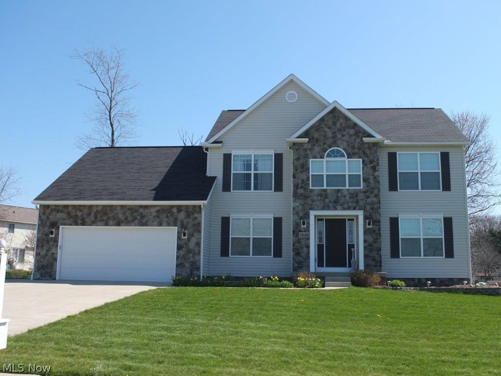 Beautiful 3 bedroom, 2.5 bath home with finished lower level and great backyard! Inviting 2 story foyer has hardwood flooring. Formal dining room and formal living room. Family room has a stone fireplace. Kitchen comes applianced with stainless steel dishwasher, range, oven and microwave and has a pantry, built-in desk, lots of counter space and dinette with slider to back deck. First floor half bath and laundry, too! Master suite has a private full bath with dual sink vanity, soaking tub and separate shower. There are 2 additional bedrooms, a full bath and a nice loft overlooking the foyer. Finished lower level offers a spacious rec room and tons of storage space! 2 car attached garage with extra storage is heated and insulated! Great backyard space includes a large deck, patio with firepit and grill with stone surround! Come see all this home has to offer!