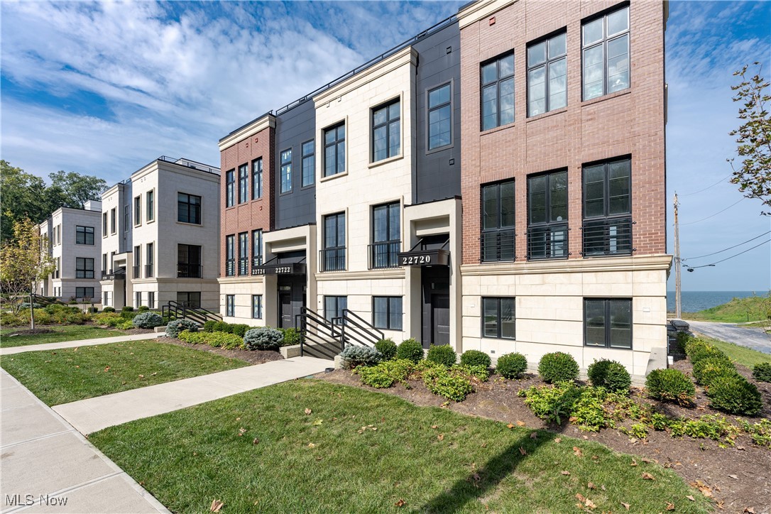 Wonderful opportunity to own new construction in Rocky River with lake views! Modern townhome with high end finishes. Open concept main floor consists of living room with gas fireplace, kitchen with large island, quartz countertops and backsplash, high end appliances, dining room and powder room. Top floor has primary suite with large closet, gorgeous tiled shower, double sink vanity. Two additional bedrooms, second full bath and laundry also on third floor. Ground floor off attached garage has large closet with front entrance off Lake Road and bonus room.