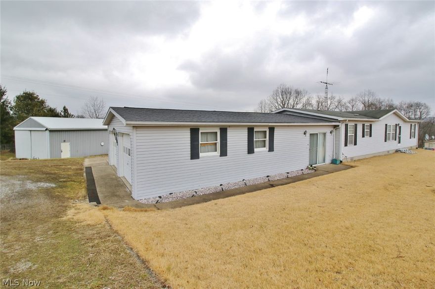 24 X 40 Pole barn. Country setting on nearly 4 acres of ground. 3 bedrooms, 2 full baths. Breezeway leads to 2 car attached garage. Aeration type septic system.