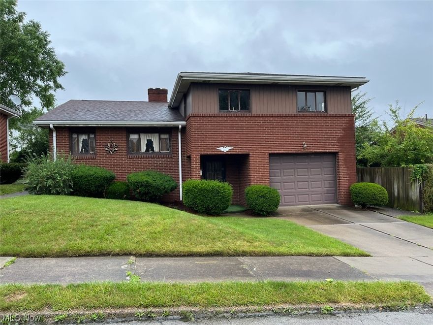 Brick split level 3 bedroom home. Family room with fireplace located on ground level. Kitchen with dining area. Full basement partially finished. Very private backyard. Deep one car built in garage.