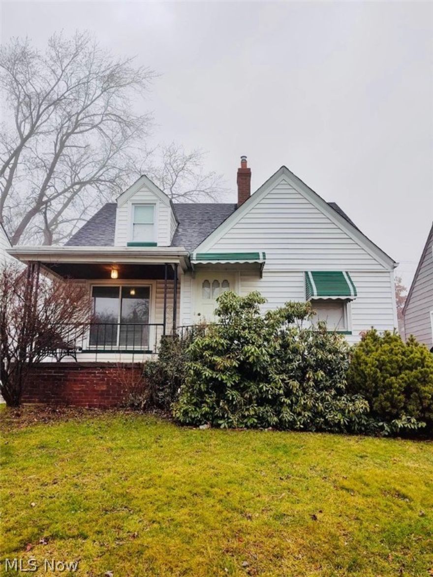 This classic Garfield Heights Bungalow/Cape Cod  is a find that won't last long! This charming home is beautifully spacious, inside & out and has plenty to fall in love with! Step from the covered front porch to a brightly lit freshly painted interior with gorgeous hardwood floors. The open plan living space flows easily from living room to the remodeled kitchen with NEW Premium Shake cabinets, stainless steel refrigerator and stove. The home has 3 good sized bedrooms, each with hardwood floors. NEW three dimensional roof and hot water tank. Newer High efficiency furnace and central air  There is also a detached garage. Located on a quiet residential street, the home is close to parks, shopping, restaurants and has easy highway access! Don't miss this amazing find - schedule a showing before it's gone!