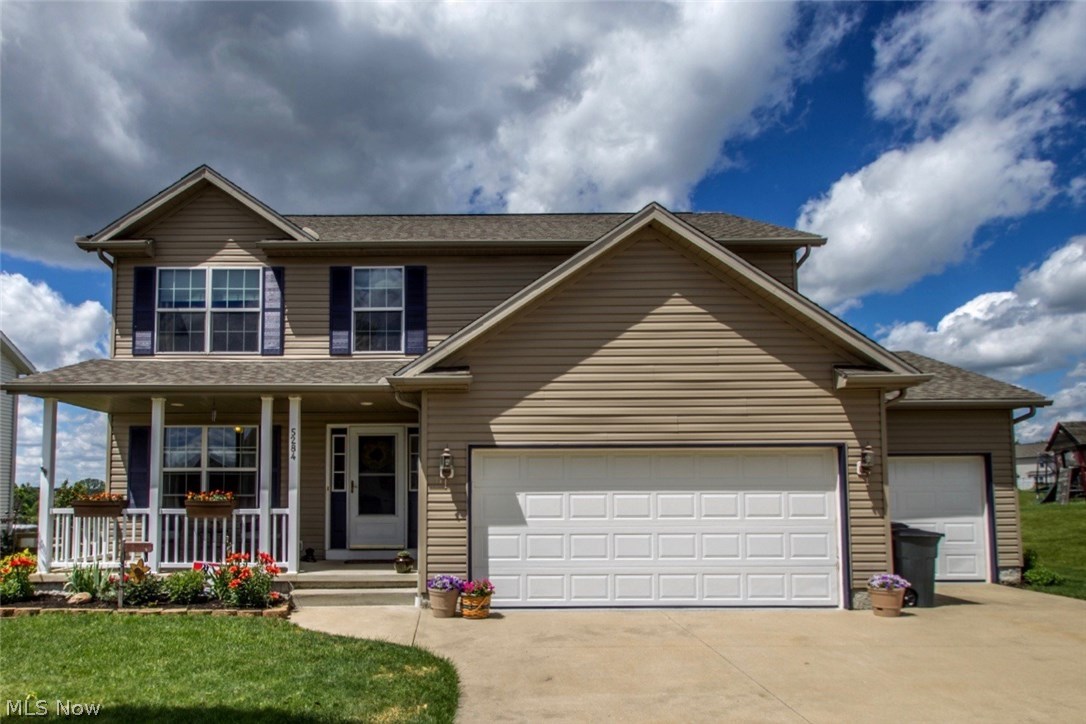 This summer, take a swim, sit on your front porch and enjoy a cup of coffee, or chill on your back deck by the pool with a good book! You can do it all here-- Country living just minutes away from Kent, Brimfield, & Routes 261 & 76! This beautiful 4 bed, 3 bath home boasts stunning wide-plank Bamboo flooring, new Carpeting in ALL bedrooms, newer Roof and Siding, and MORE! Second Floor Laundry means no more running up and down! The low-maintenance composite Deck & above-ground Pool (2012) will be a hit with your guests as will the gorgeous back yard view with room to run and play. And check out the Third Garage Bay and Central Vac! Add trendy & tasteful Paint palette throughout and you have the makings of a turn-key property! Owner's Suite with vaulted ceiling leads to Master Bath with garden tub and walk-in Owner's closet. All kitchen appliances are new since 2012! Sunroom addition, added in 2012, adds about 200 sq. ft. of year-round living space w/ slider that leads to deck/pool. Lower level rec room adds another 350+ square feet to the Total Living area. So much to like here, you have to see it in person to believe it! Full improvements list available. One-year home warranty for the lucky buyer! Come home to this beautiful countryside Colonial!