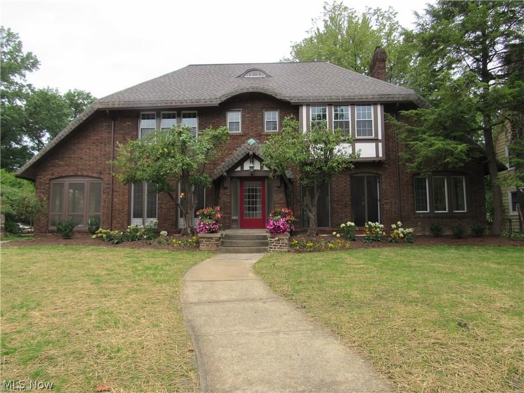 Stately Brick Tudor Inspired Colonial, brought back to its original splendor! Architectural integrity maintained while adding today’s updates! Grand Living Room w/ slate fireplace has floor-to-ceiling French doors! Delightful Sunroom w/ windows surrounding the perimeter & restored tile floor become an extension of the Living Room. Stunning Formal Dining Room w/ paneled walls & soaring windows. Step onto the screened-in Porch complete w/ stained wood plank ceiling; an inviting retreat to enjoy the night air. Kitchen bridges past w/ the present; includes SS appliances, granite, large island & pantry, plus custom butcher block, constructed w/ repurposed wood that adds such a great touch! The cozy Breakfast room w/ a bay window makes a great addition to the Kitchen! Wonderful Master Suite w/ ample storage & gorgeous Bath featuring double sinks, heated tile floor, & huge rain shower w/ a custom glass wall. 3 additional bedrooms, a Full Bath & convenient 2nd floor laundry w/ included LG wash