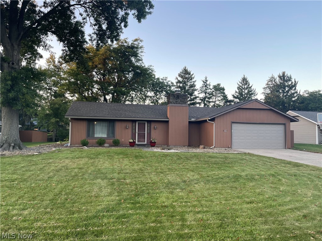 This charming 3-bedroom, 2-bath ranch in the desirable Forest Park development is now available! The updated open eat-in kitchen, with new granite countertops and bar seating, flows into the family room which features a wood-burning fireplace. Large, picturesque sliding doors open onto the patio and spacious backyard. The primary bedroom features a walk-in closet with built-in drawers, built-in shoe rack, an en-suite bathroom, and an abundance of natural light with large patio doors that lead out back. Ample closet space with built-in drawers are also featured in the second and third bedrooms. Recent updates within the last few years include a patio, roof, granite countertops in the kitchen, dishwasher, hot water tank, recessed speakers in the kitchen, patio & family room, as well as a new garage door. The dining room, living room, and patio sliding doors have newer windows. The extra-wide garage, with hot and cold water, is complete with a workbench containing electrical outlets, a sliding door closet with shelves, and three walls of built-in pegboard for storage. The neighborhood boasts wonderful amenities, including a 7-foot deep pool, an enclosed kiddie pool, pickleball and tennis courts, a playground, and a rentable air-conditioned clubhouse. The neighborhood also provides direct access to metro parks' walking and biking paths. This quiet, idyllic neighborhood offers serene surroundings with convenient access to the turnpike and I-71. Located just 2 miles from the Plaza at SouthPark and Royalton Road Greens of Strongsville, you’ll find plenty to do as you eat, shop, and relax in the heart of this endearing city. Don’t miss out on the opportunity to make this delightful property YOUR new home!