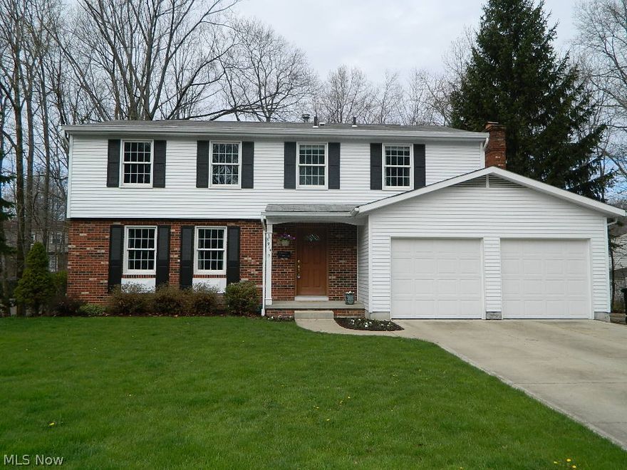 This beautiful colonial, in move-in condition, has the updates you are looking for both inside and out. Kitchen with cherry cabinets, Corian counter-tops, ceramic floors. Crown molding and hardwood floors in living/dining rooms. Fully updated bathrooms with granite counters. New carpet in family room with fireplace and slider door to serene park like back yard. Master bedroom features new closet system and updated bathroom. Basement partially finished with rec room, laundry, storage and work shop. New garage door openers. Lots of landscaping work done including leveling of backyard and new brick patio/stairs and retaining wall. 2005 furnace & A/C, extra large driveway 2004, windows and doors 2000. Akron General Wellness Hiking Path just around the corner, close to police station, parks, playgrounds, and schools. Just move in and enjoy!