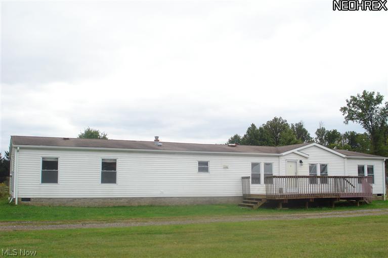 Enjoy the ease of 1 floor living on 5 wonderful acres. Over 2100 sq ft, 4 bedroom ranch. Open floor plan. Inviting kitchen w/breakfast bar. 1st floor laundry. Formal dining area opens to rear deck w/view of private pond. Bedrooms are split w/ 3/1 design. Master bedroom suite w/glamour bath. Bath has large tiled shower & separate soaking tub. You will be thrilled w/the 13x6 walk-in closet. New tilt in windows, vinyl siding, flooring & more!