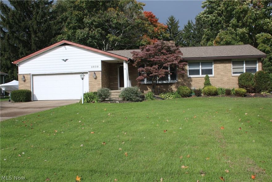 Split Ranch style home with full basement.  Large living room with gas fireplace and large bay window with tons of natural lighting.  Dining room and spacious Kitchen with an open floor plan.  Newer laminate flooring with oak cabinets and breakfast bar.Dining room with access to enclosed, vaulted ceiling 3 season room.  Attached two level deck and gazebo with new hot-tub this year.  Wonderful extra space for entertaining.    Three bedrooms with an optional 4th currently an in-home office.   Full walkout basement, Wood fireplace, bar area,  workshop, huge laundry room and so much more.  Sq Ft is the same footprint and main floor,  Soooo much opportunity here to make exactly what you want.  Two car attached garage situated on just over half acre lot.   Outbuilding for extra storage.