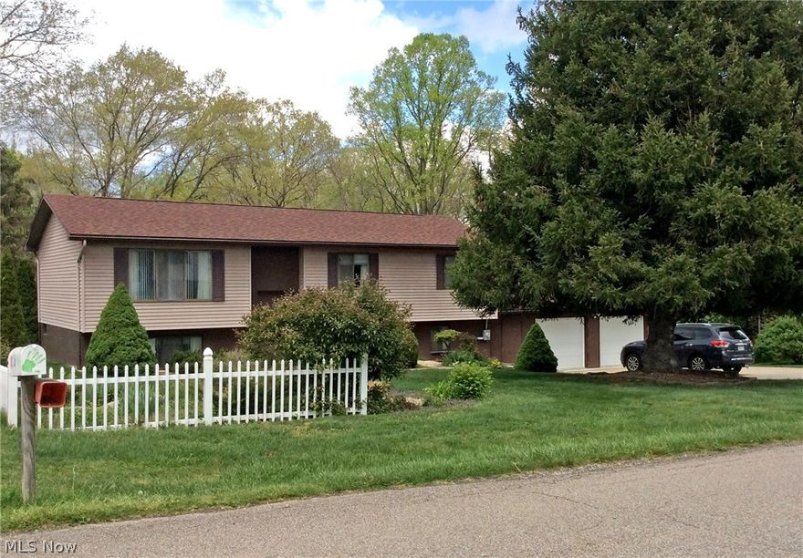 New oversized 2 car garage and driveway were added in 2011 along with New roof on house and garage.  Updates in 2014:  Floor and sink in kitchen, new sink in full bath.  2015:  New electric clothes dryer and 2016 new dishwasher.   Loads of storage. Great family neighborhood & schools. Lovely yard.